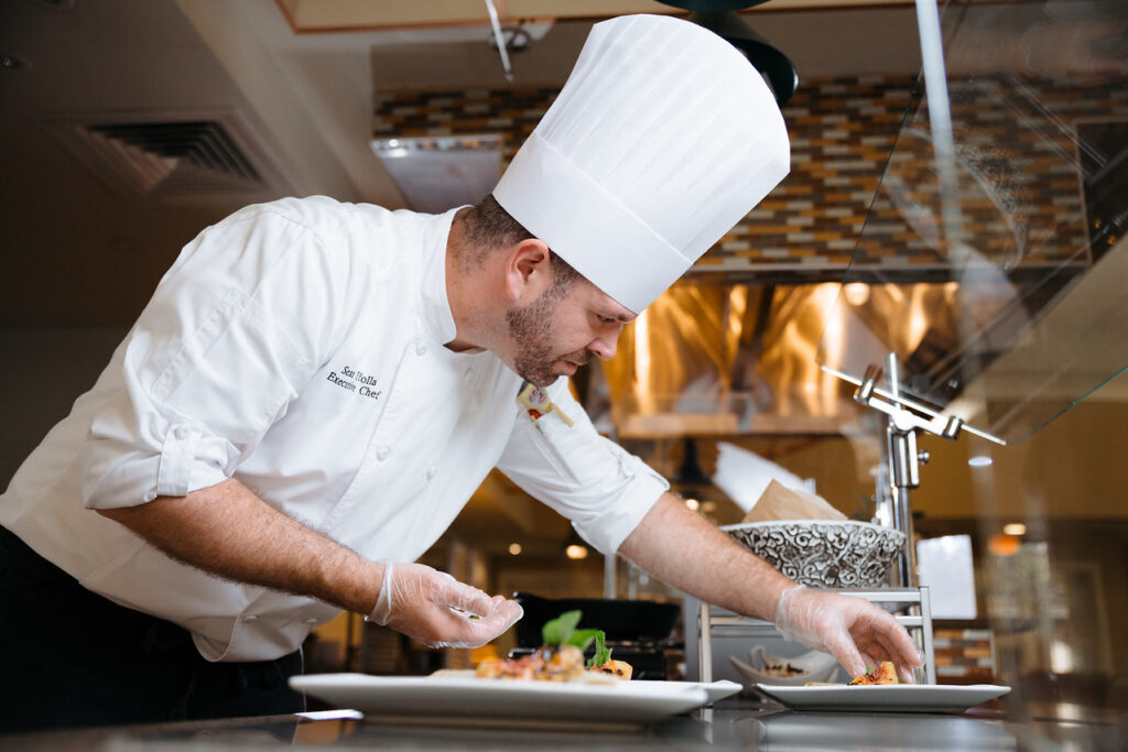 chef garnishing the plates