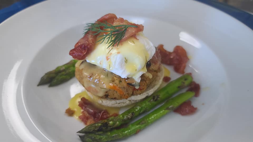 salmon croquette served with bacon, eggs, and asparagus