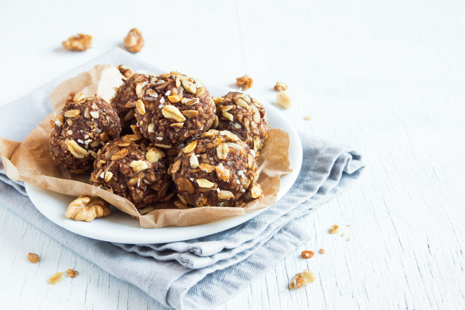 Healthy organic energy granola bites with nuts, cacao, banana and honey - vegan vegetarian raw snack or meal