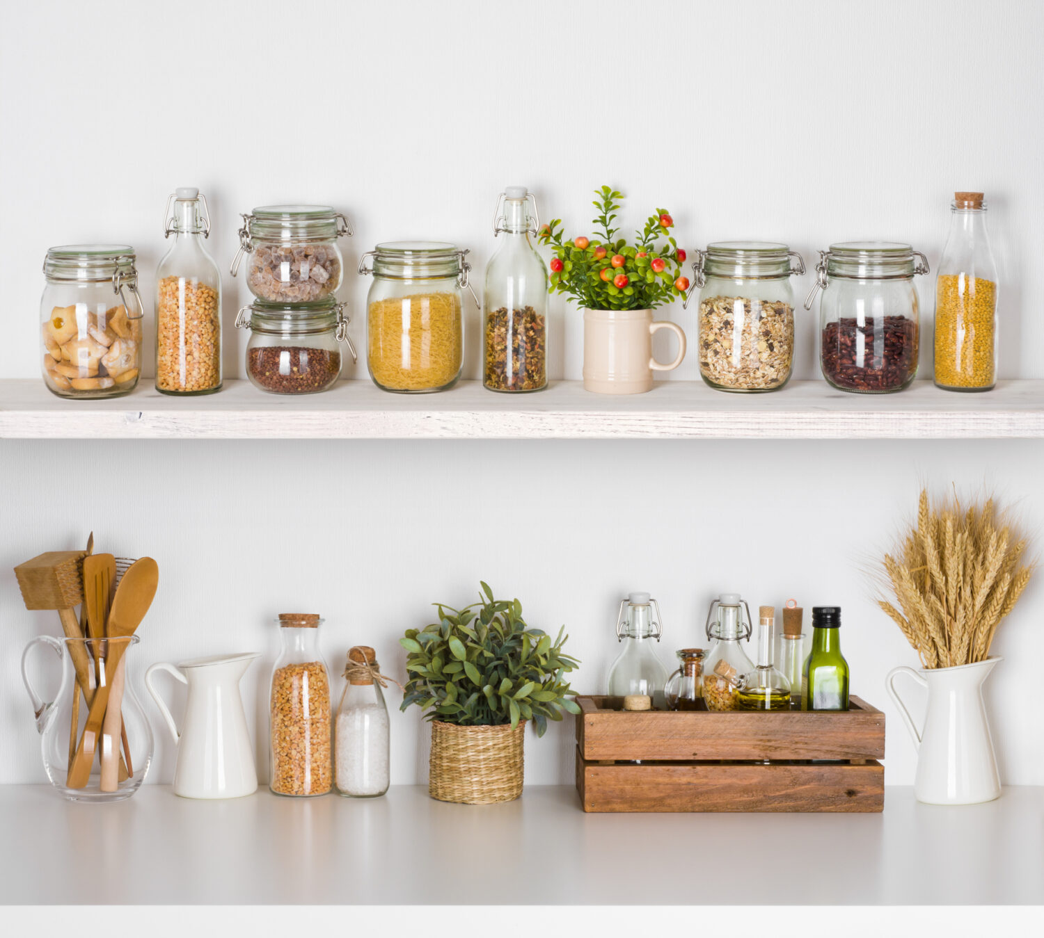 Modern kitchen shelves with various food ingredients on white background